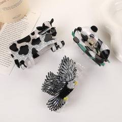 Generic cow clip in bathroom mirror lifestyle keeping hair back while applying makeup