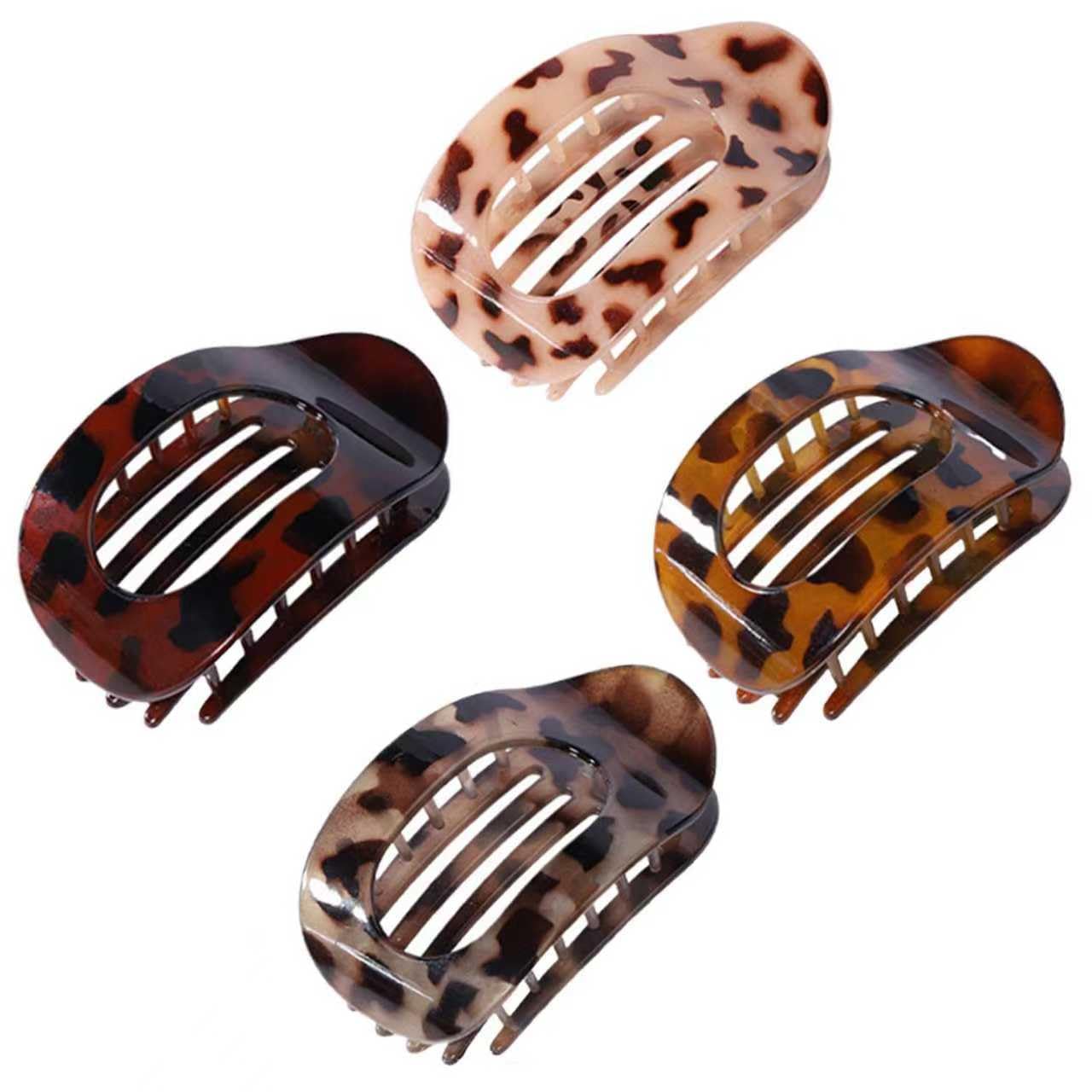 Generic front view of four flat claw clips showing colors and matte finish benefit