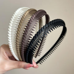 Generic brand front view of headband showing sleek shape and secure hold