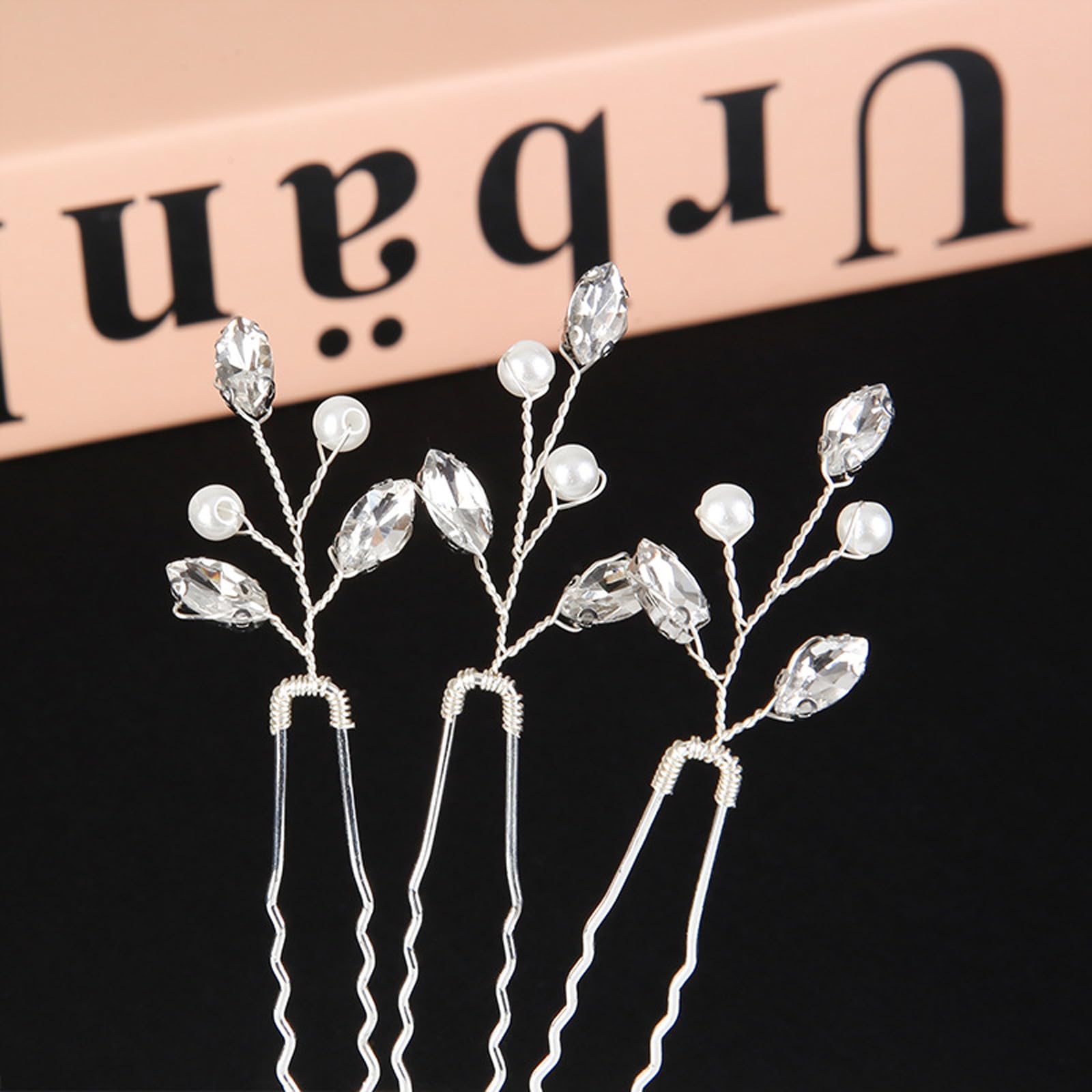 Generic bride and bridesmaids wearing pins for cohesive formal hairstyle accents