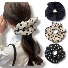 Generic close-up of black-and-white polka dot satin showing pattern clarity and charm