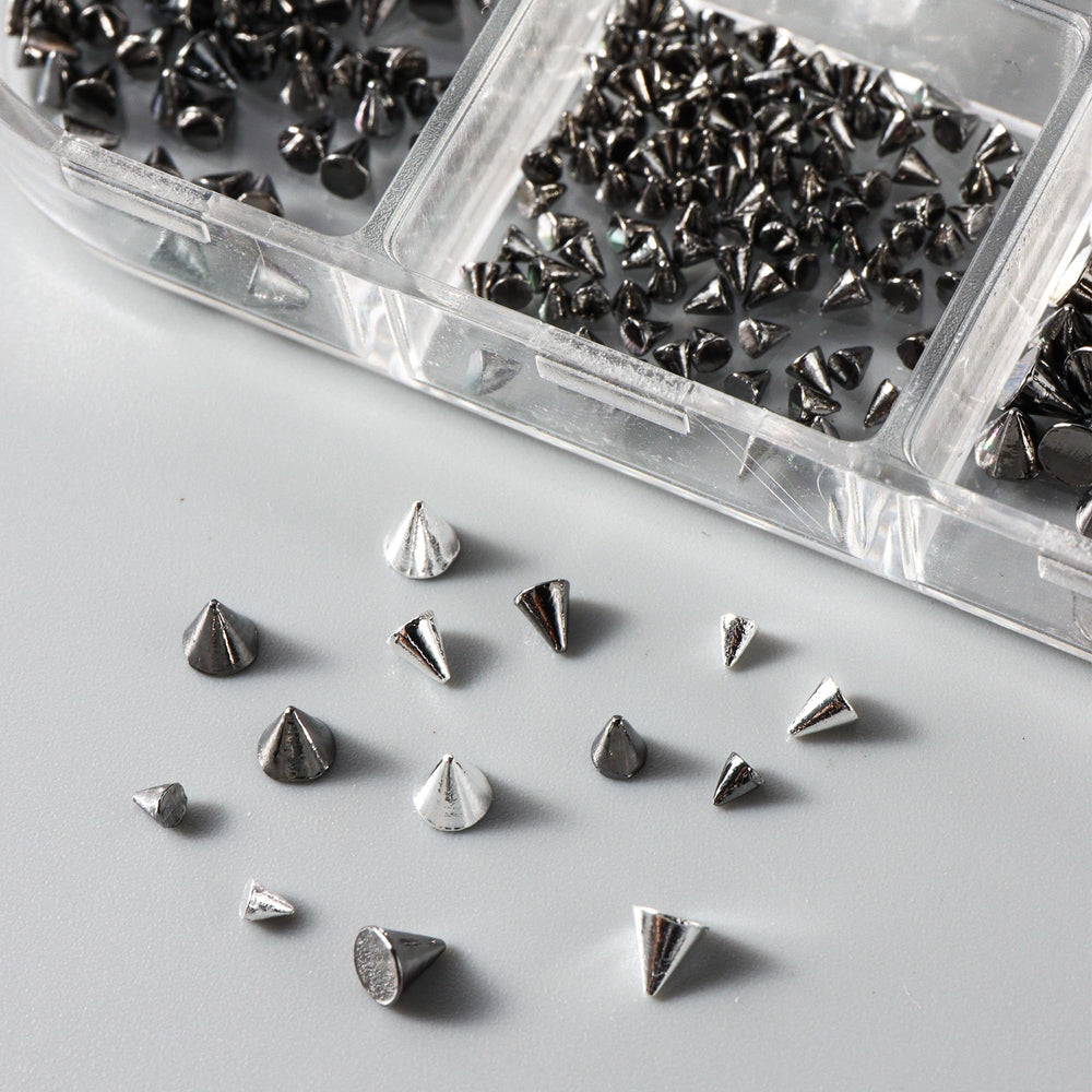 Generic scale comparison of studs on a fingertip showing size options and fit