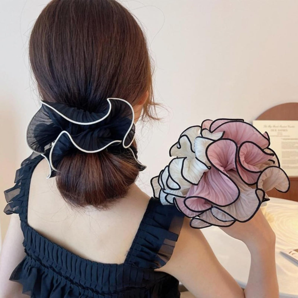 Generic scrunchie worn on wrist as accessory, convenient and stylish between uses