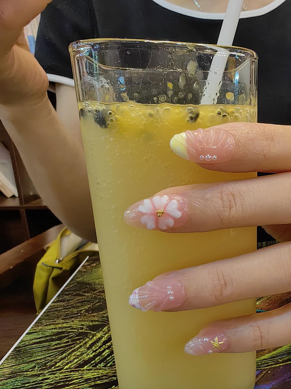 Generic Seafish A02 nails worn on hand in daylight displaying beach-inspired style and versatility