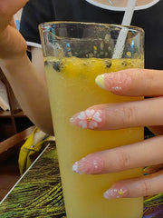 Generic lifestyle shot of nails worn at the beach displaying summery style