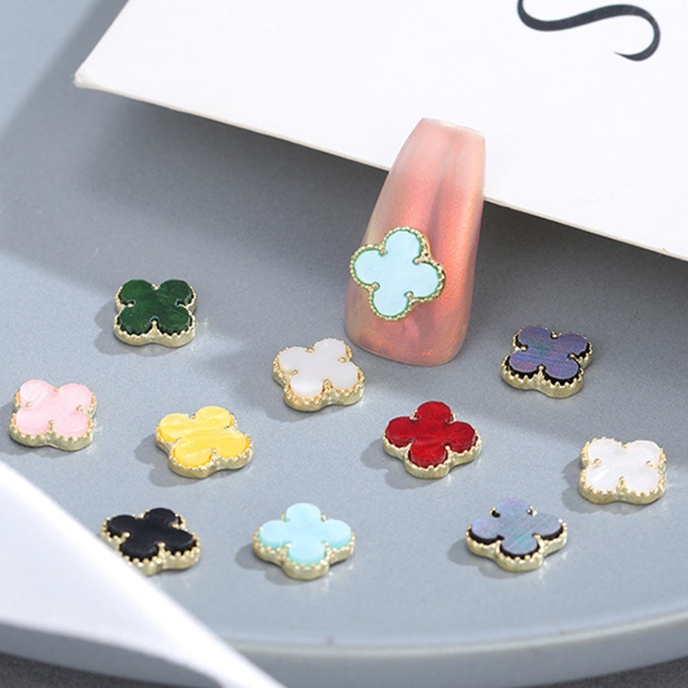 Generic sealed clover charm under topcoat highlighting glossy hold and long-lasting wear