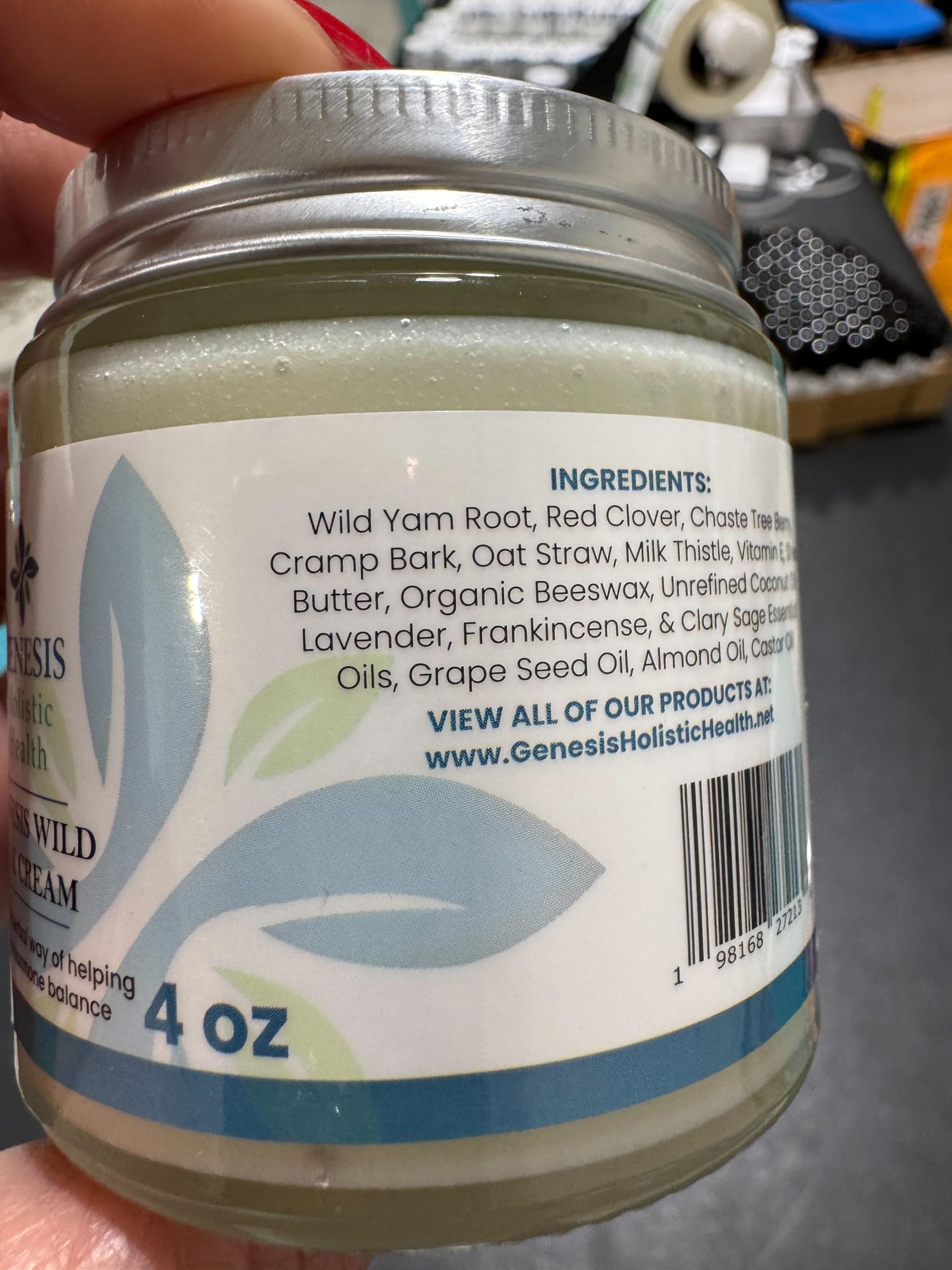 Genesis Holistic Health 4 oz jar next to a measuring tape indicating compact travel-friendly size