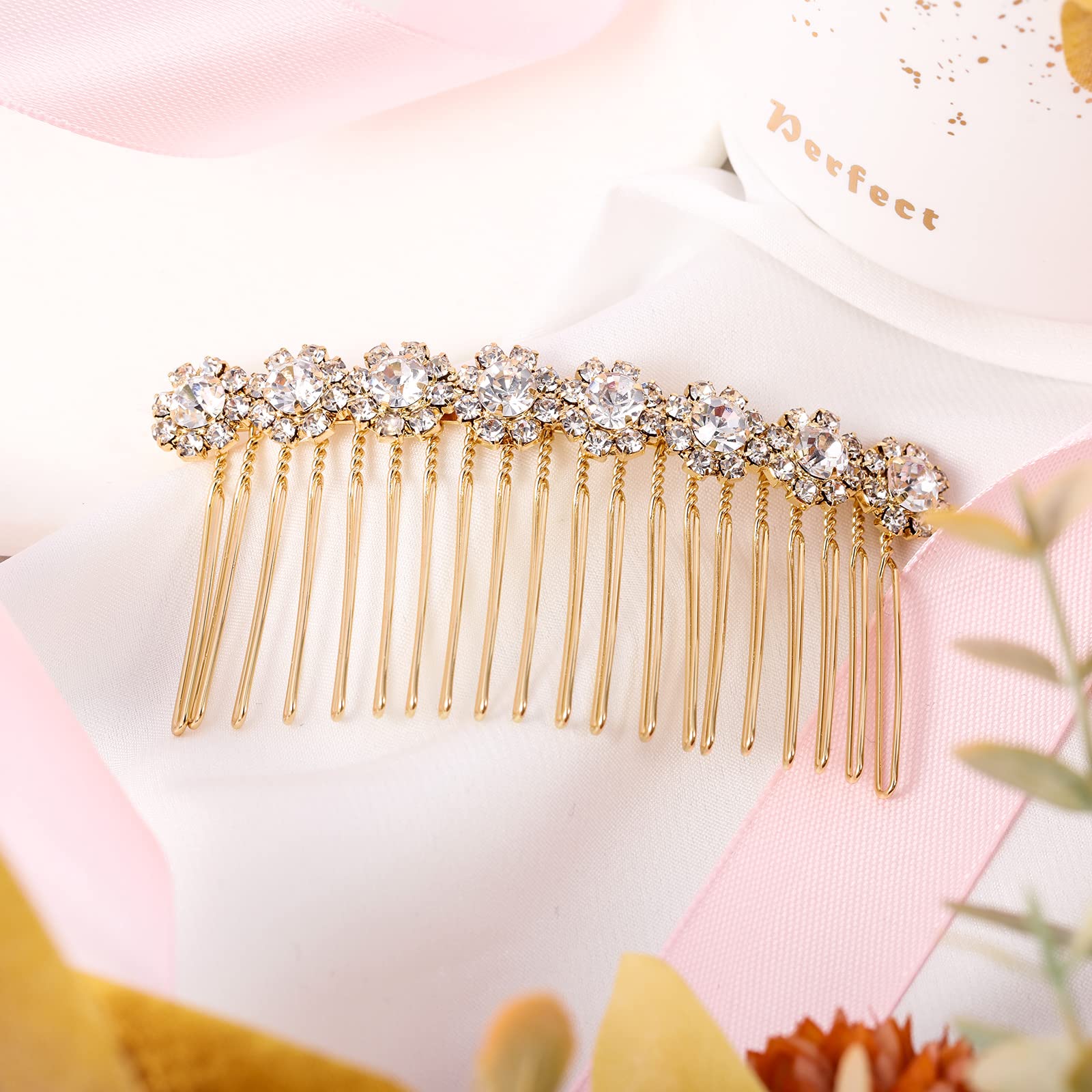 Geosar comb worn with veil in lifestyle shot, demonstrates polished wedding look