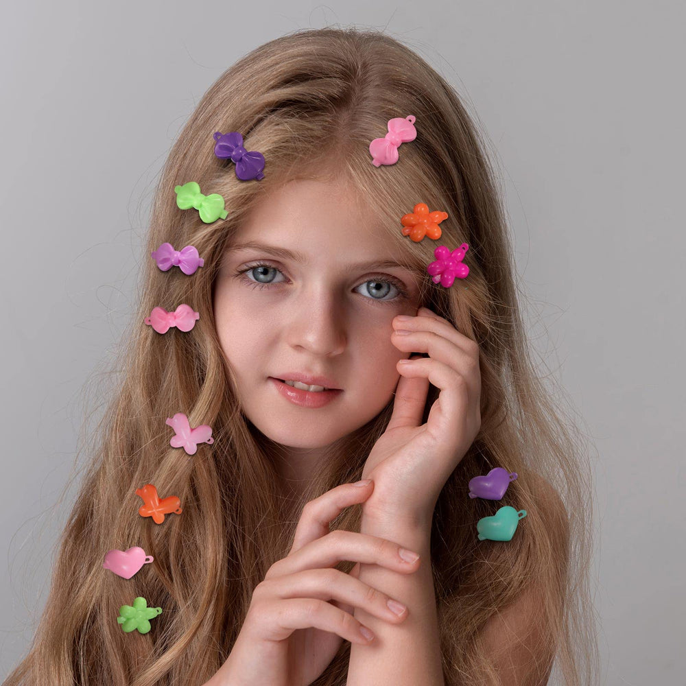 Giegxin birthday party hairstyle using multiple clips adding colorful, festive detail