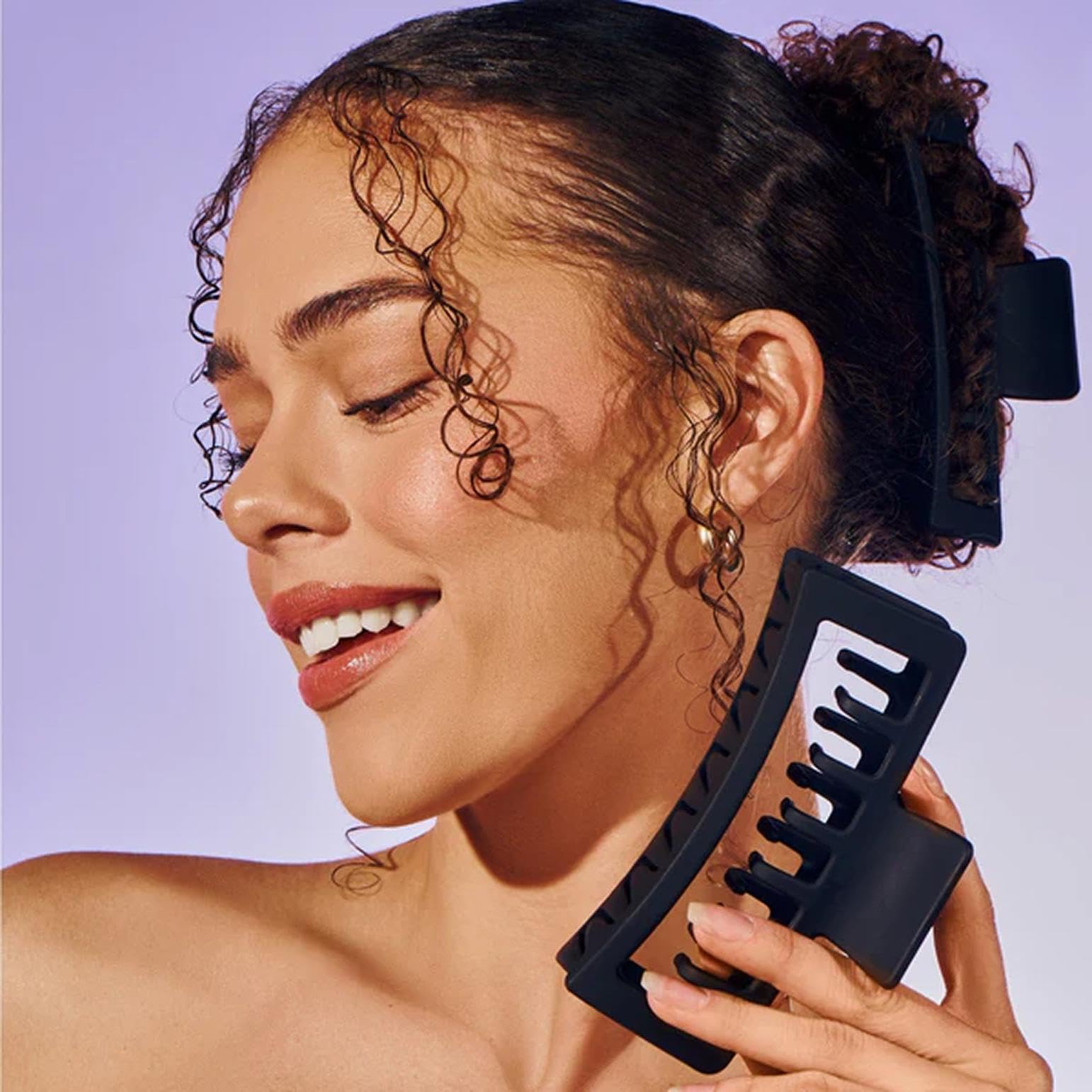 GIMME clip held in hand showing size and scale for medium hair fit