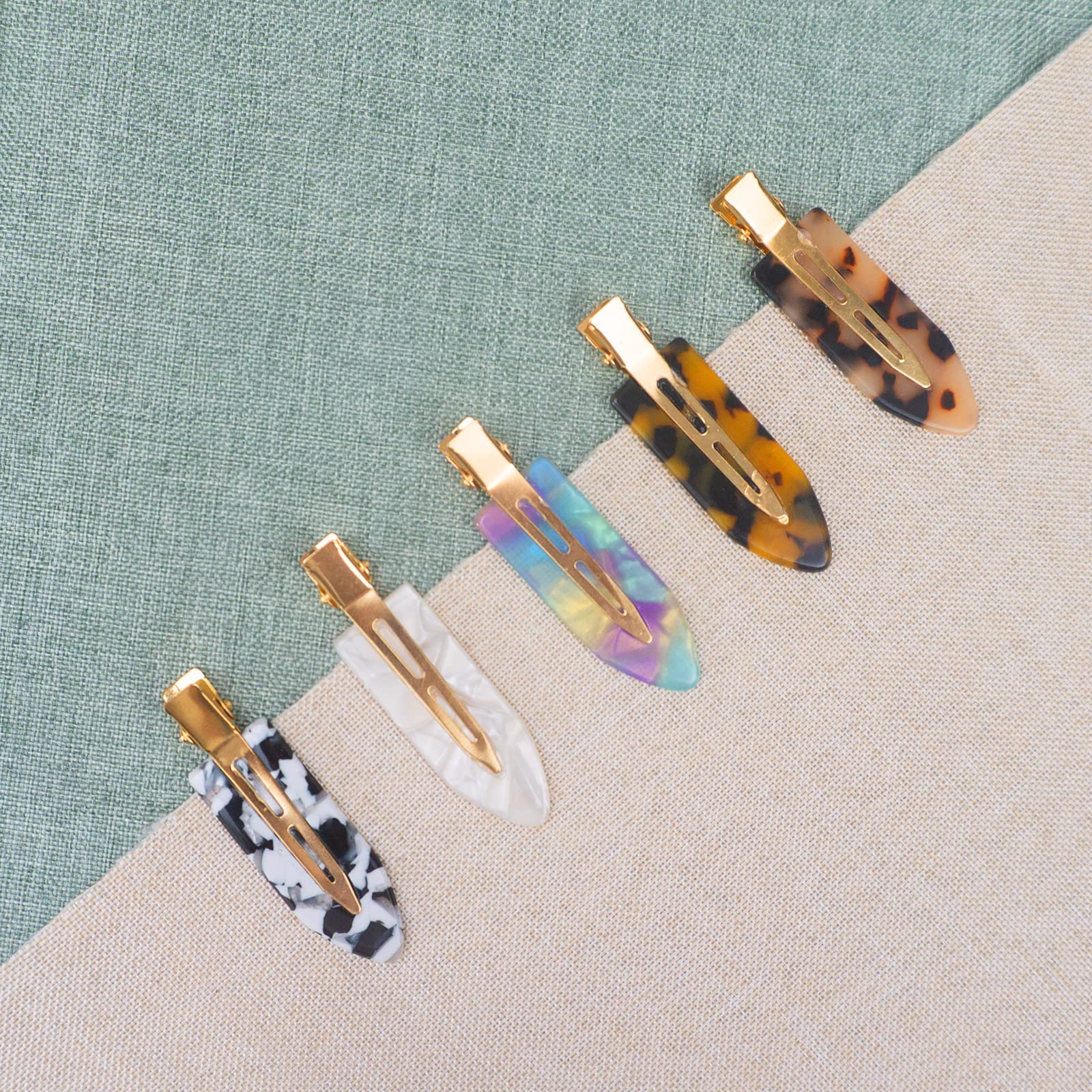 Gingbiss clip securing bangs to keep hair out of face during makeup application