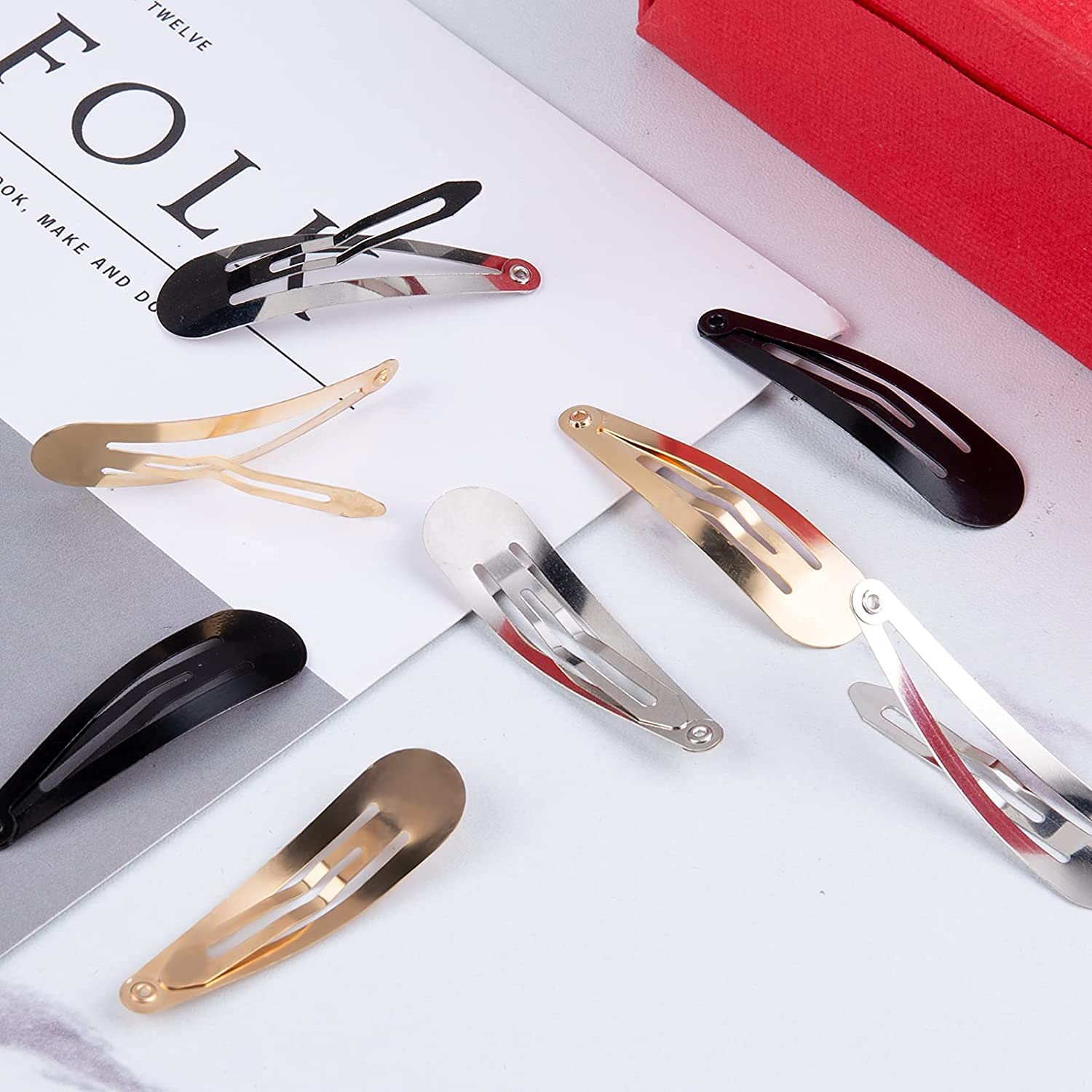 Gingbiss clips in hand illustrating the 2-inch size and comfortable portability