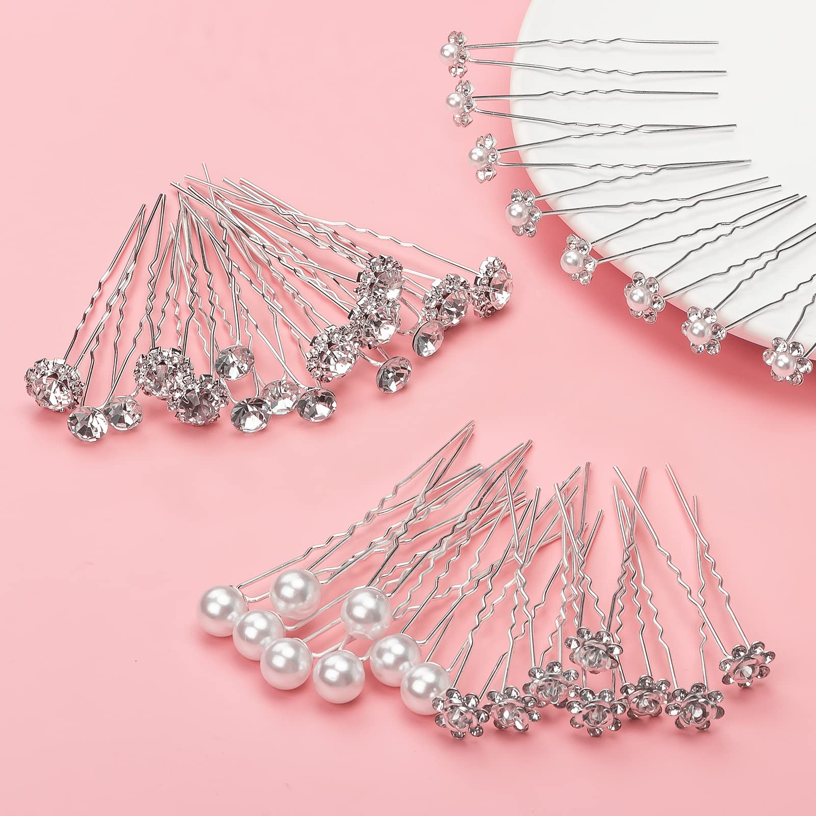 Gingbiss pins beside a ruler to show 2.75 inch length and precise sizing for hairstyling