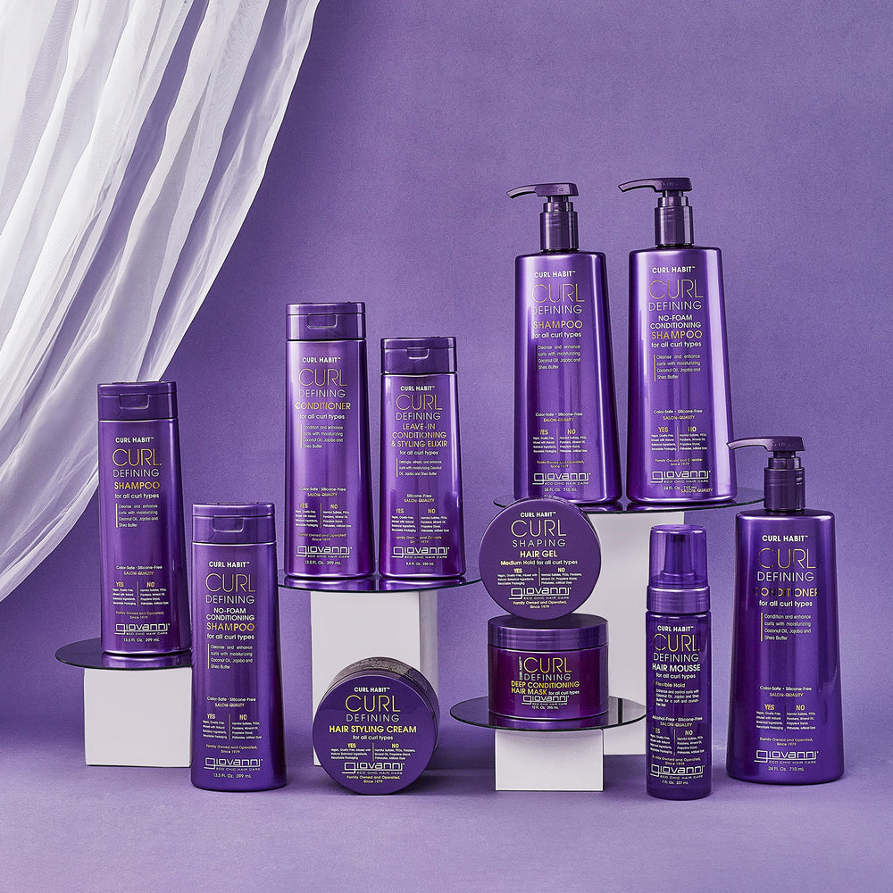 GIOVANNI applying elixir to damp curls for improved definition