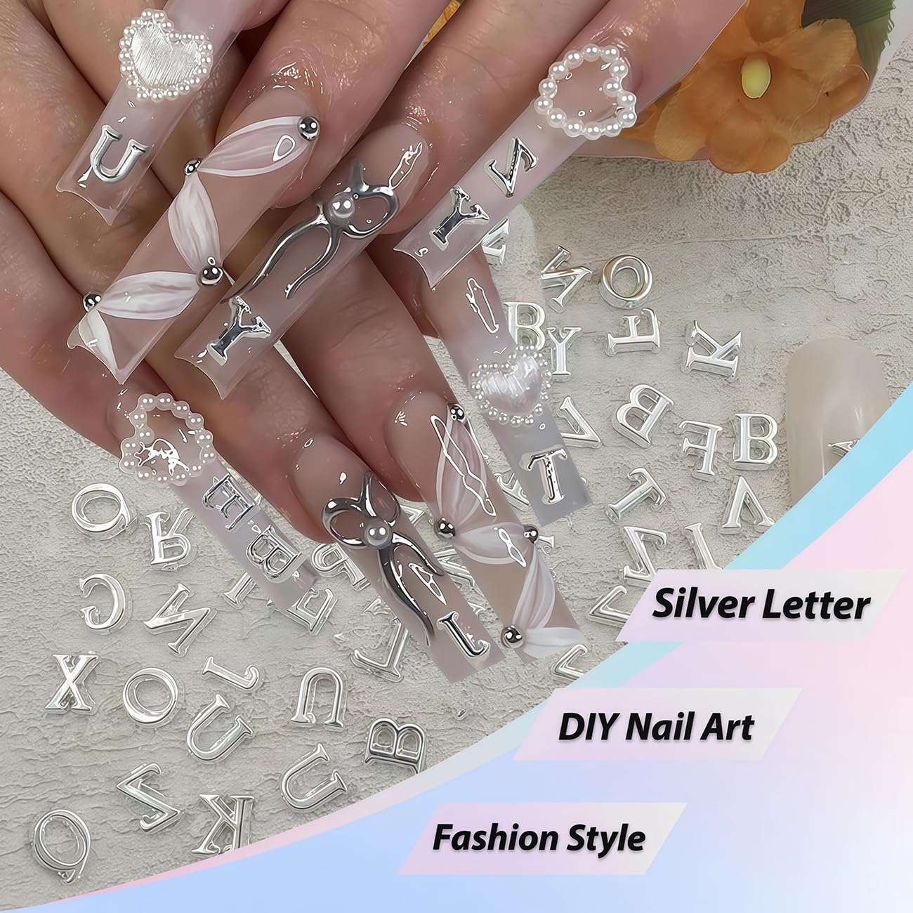 GJJBQTT letters applied on acrylic nails, demonstrates readable stylish accents