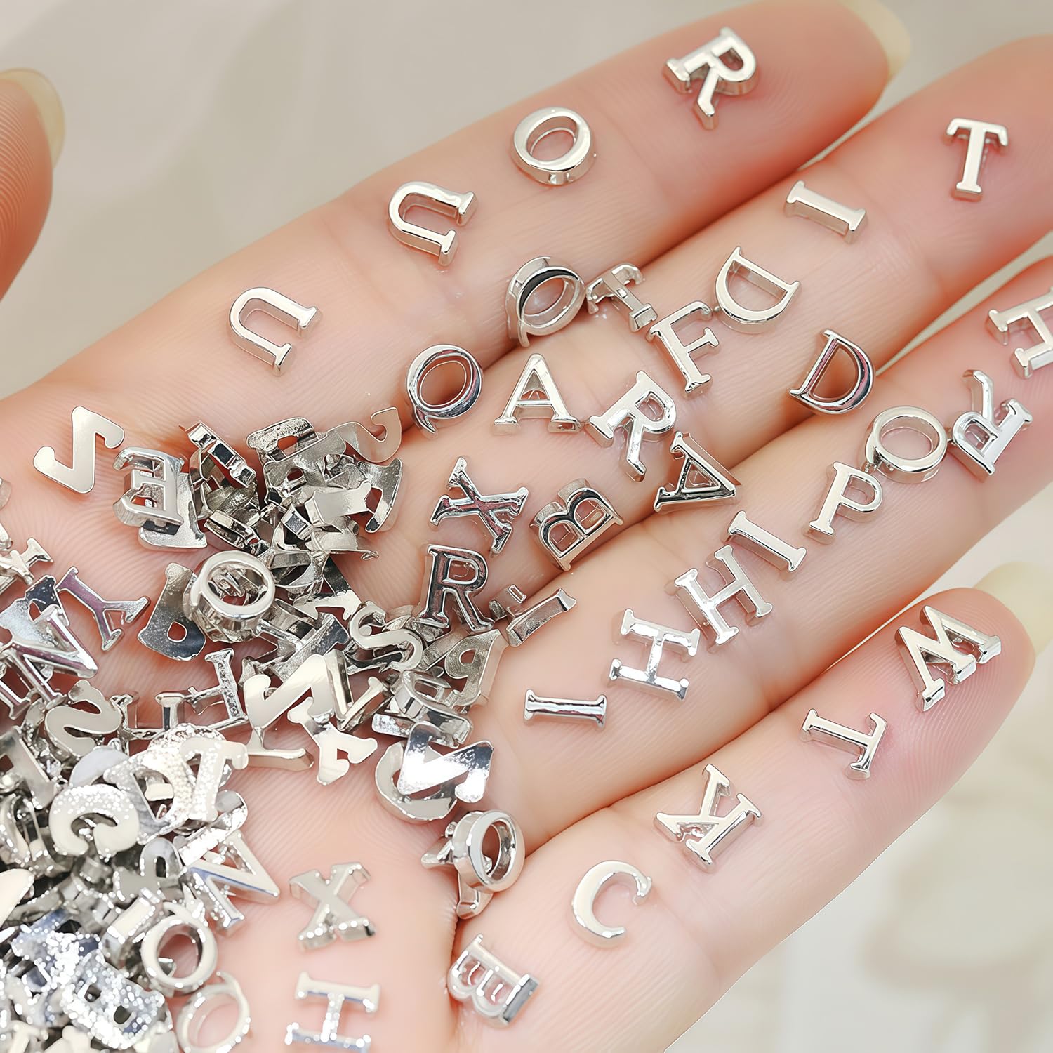 GJJBQTT front packaging showing 200 silver letter charms, adds personalization