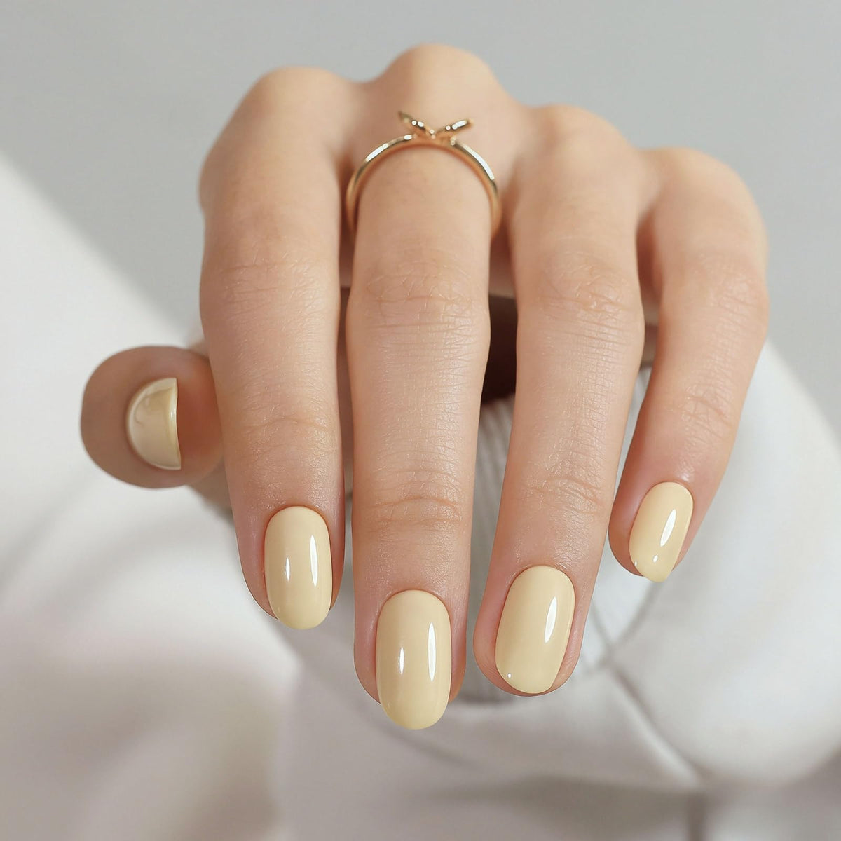 GJZEZ front packaging showing pastel yellow press-on nails and kit benefits