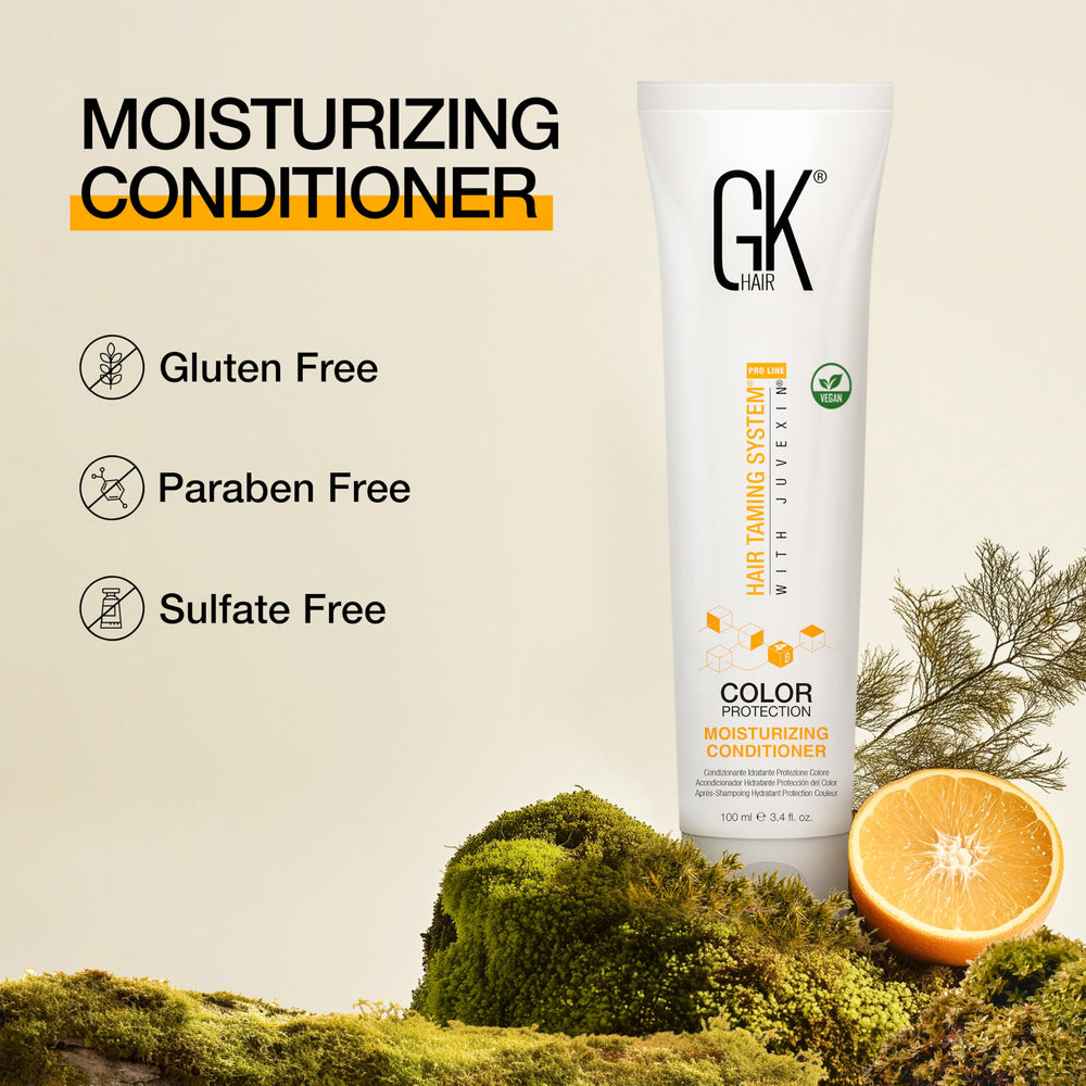 GK HAIR 100ml bottle held in hand showing compact travel-friendly size