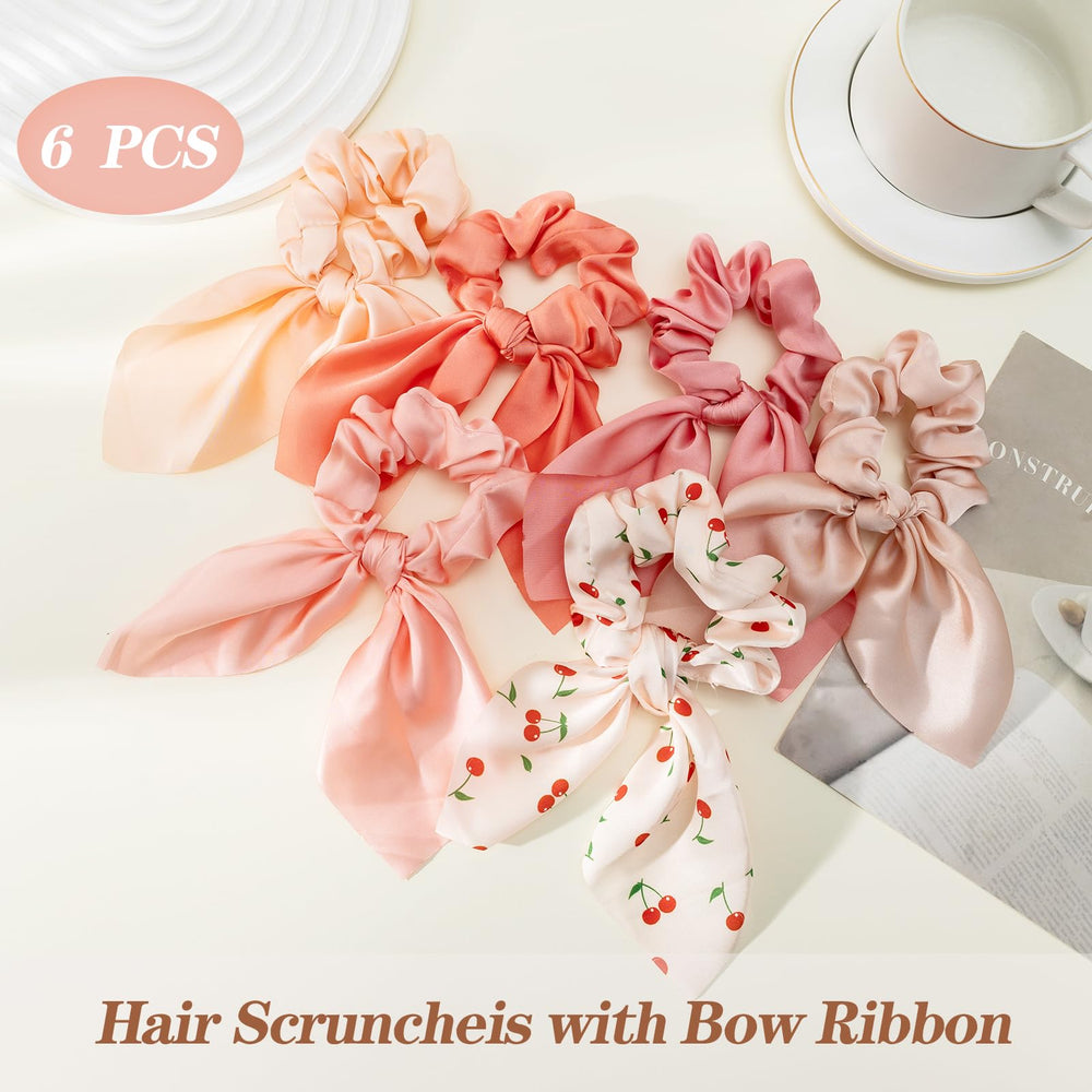 Glaudmeiss scrunchie tied to handbag showing accessory versatility