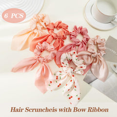 Glaudmeiss scrunchie tied to handbag showing accessory versatility