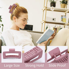 Glaudmeiss size comparison in hand showing the 5-inch capacity for voluminous hair