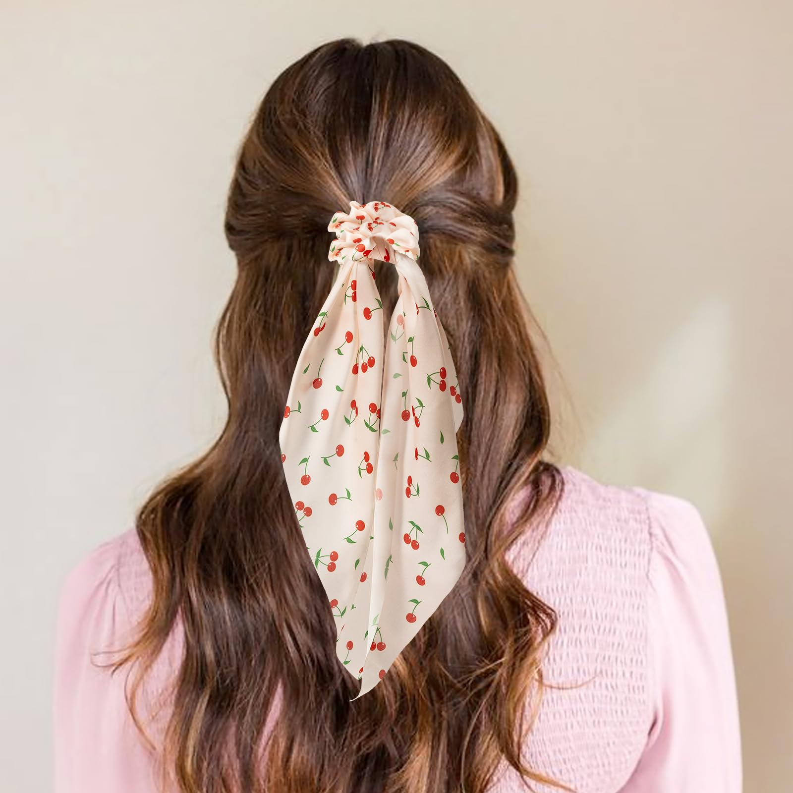 Glaudmeiss scrunchie worn on wrist as accessory offering hands-free styling option