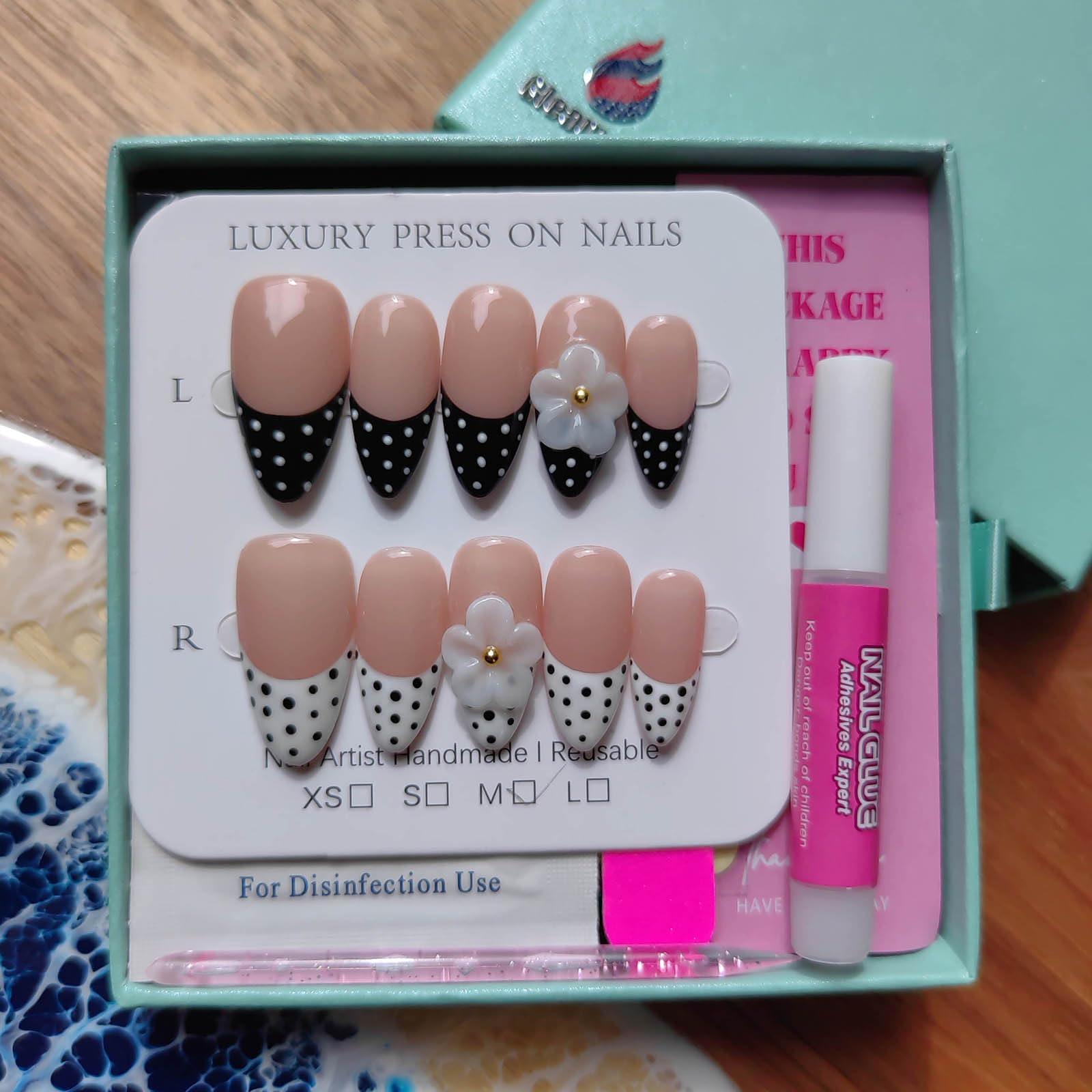Gleamrain size comparison on finger illustrating medium almond fit for most nails