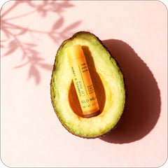 Glo Melanin in outdoor setting, protects and refreshes lips on-the-go