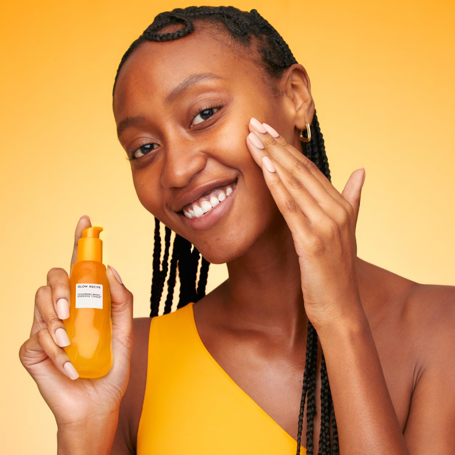 Glow Recipe essence dispensed on hand illustrating hydrating finish
