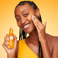 Glow Recipe essence dispensed on hand illustrating hydrating finish
