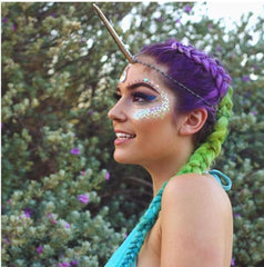Go Ho model at a festival wearing glitter, demonstrating long‑lasting wearable sparkle