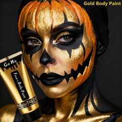 Go Ho metallic gold full-face SFX makeup creating bold festival look