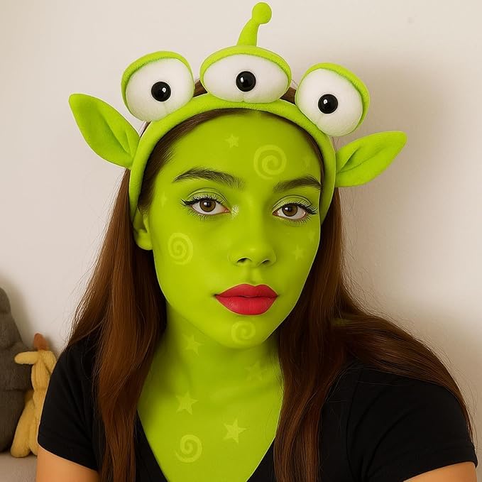 Go Ho ogre green next to hand showing stick size and travel convenience