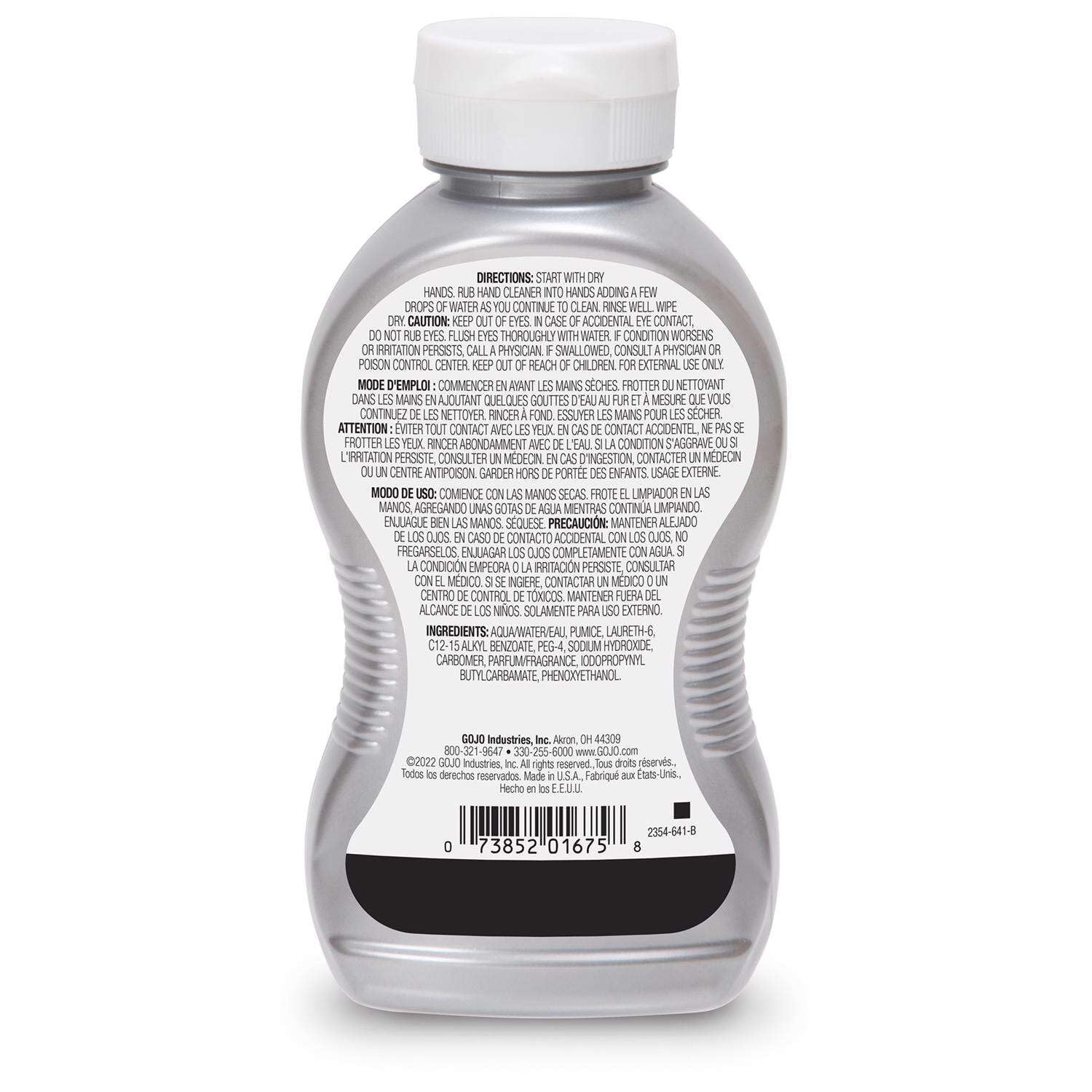 GOJO bottle in use as a worker washes greasy hands for fast soil removal