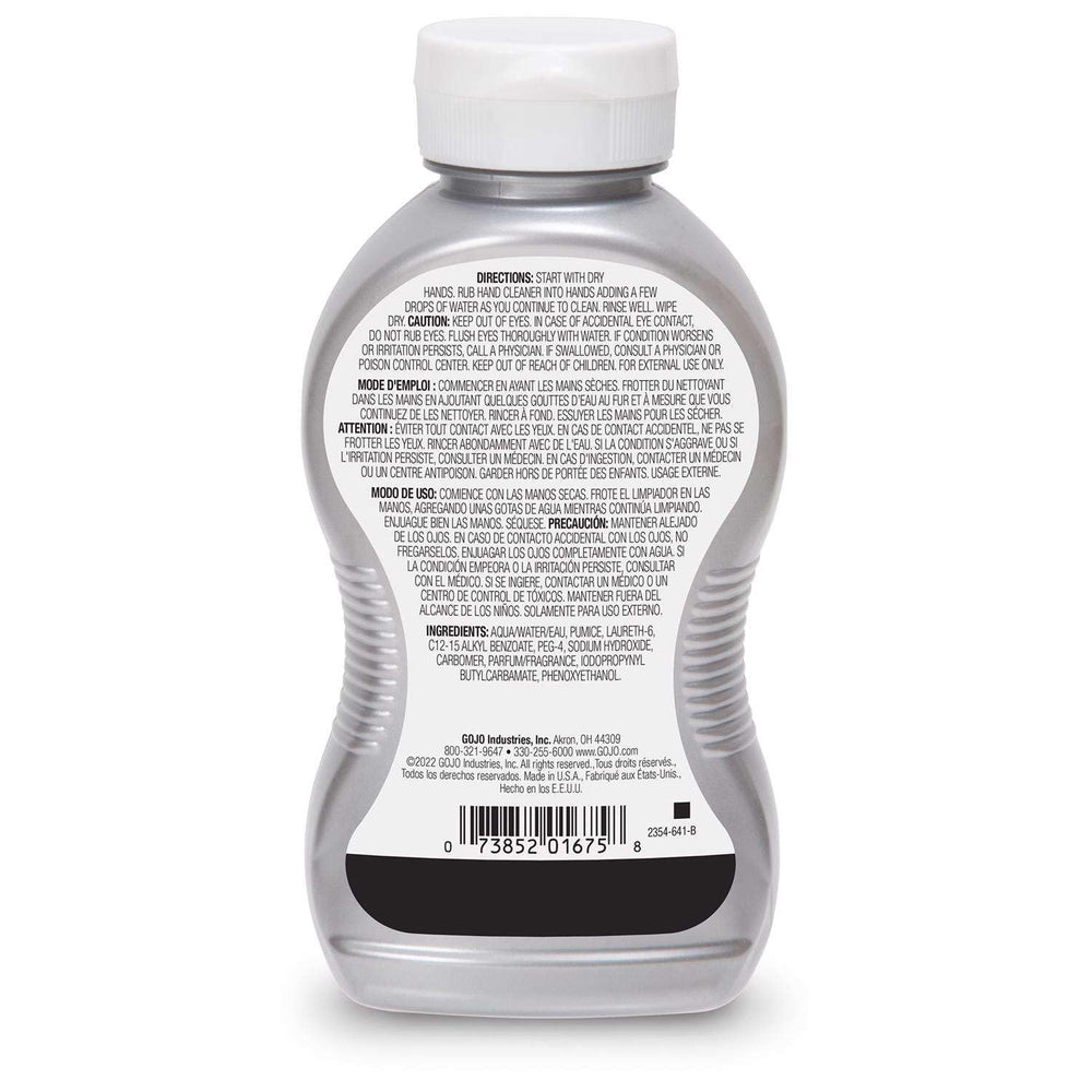 GOJO bottle in use as a worker washes greasy hands for fast soil removal