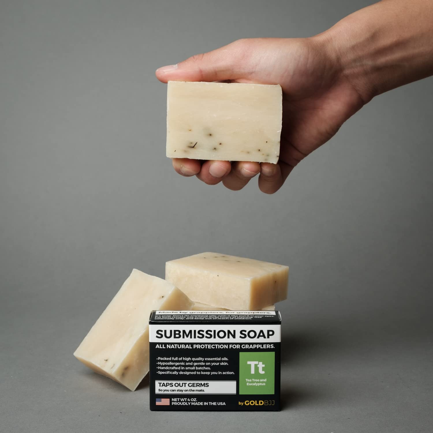 Gold BJJ soap in gym bag lifestyle shot demonstrating travel convenience