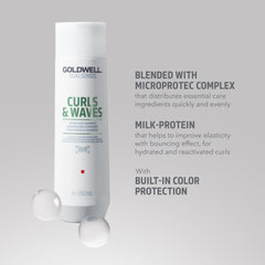 Goldwell 1L pump bottle beside a hand for scale and convenient refill benefit