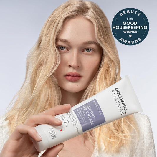 Goldwell cream texture on hand demonstrating lightweight spreadability benefit