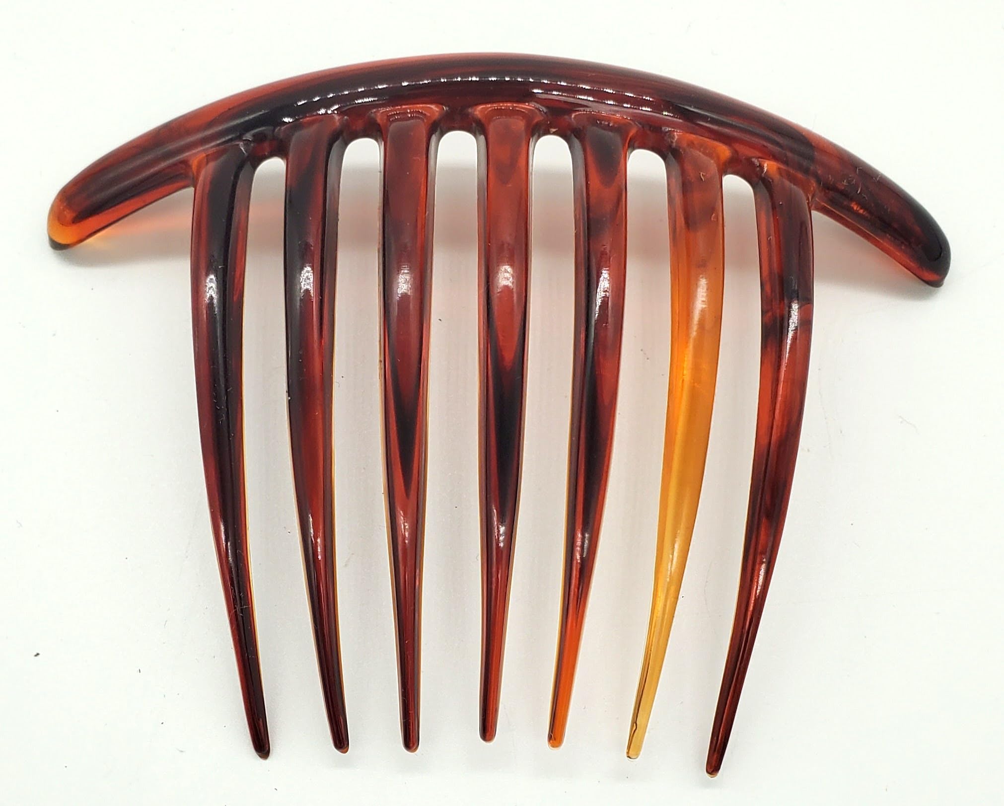 Good Hair Days comb held in hand showing 4 by 3 inch size for portability