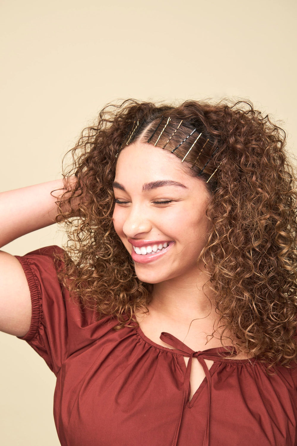 Goody bobby pins securing an elegant updo for all-day hold during events