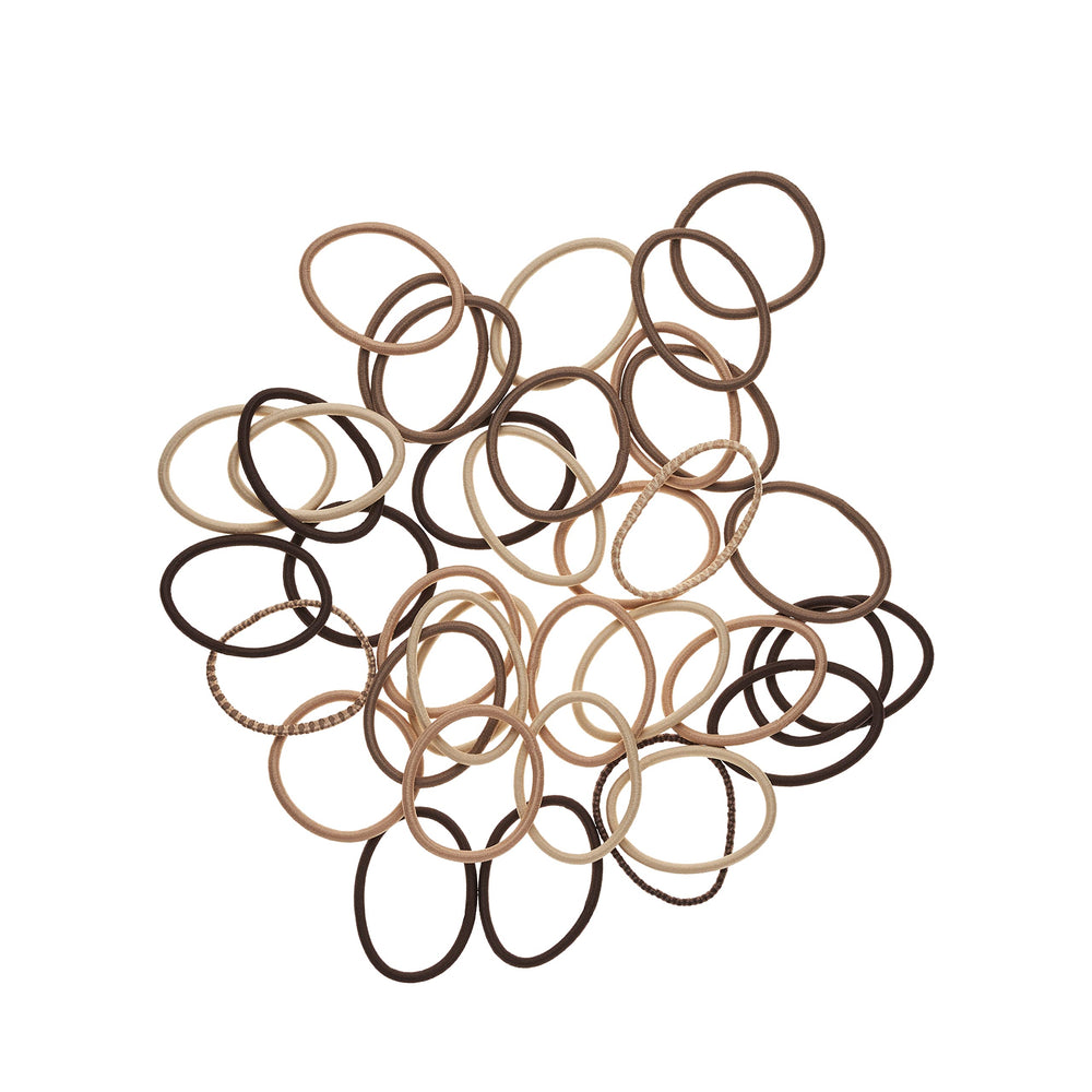 Goody elastics in woman’s ponytail demonstrating secure no-pull hold