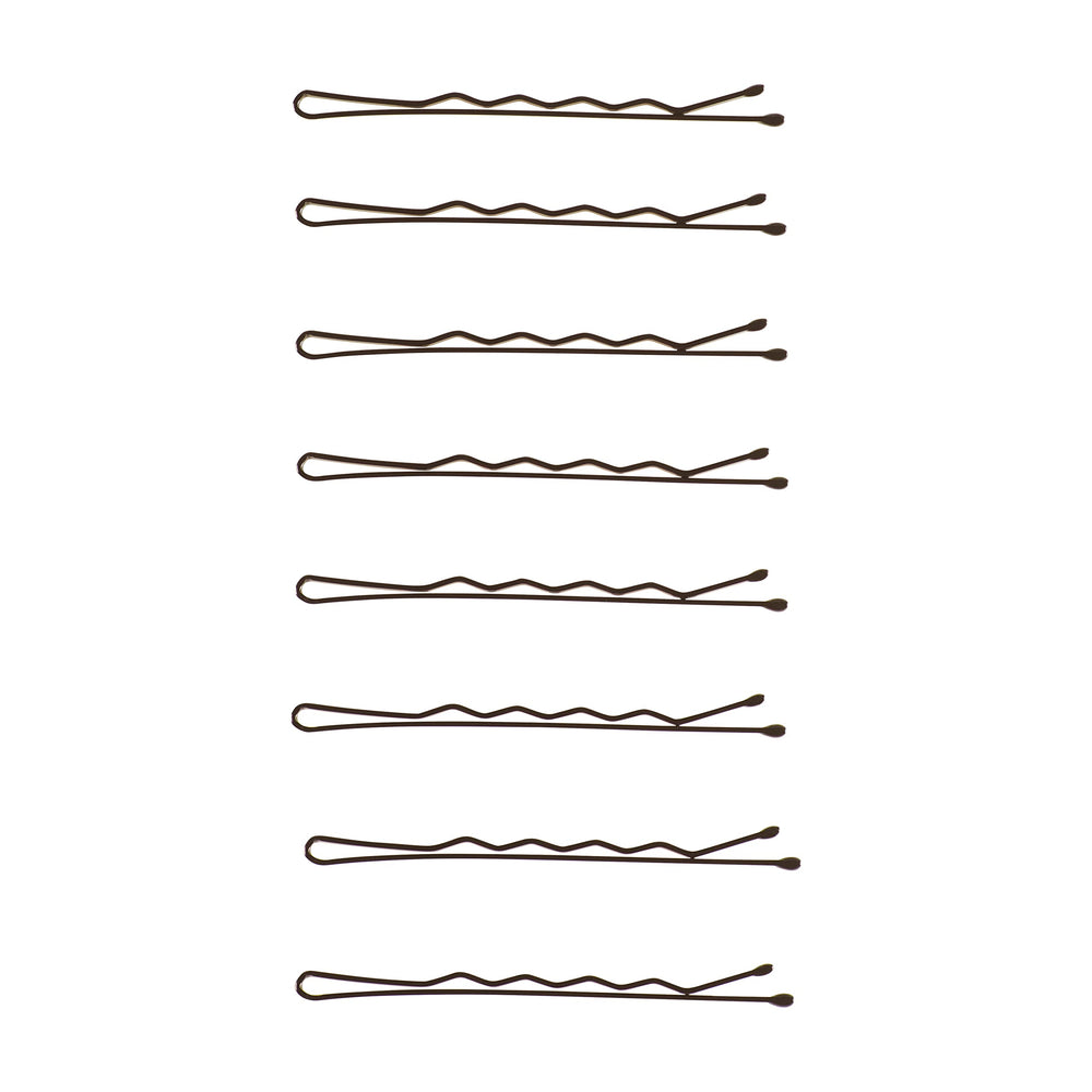 Goody pins next to a ruler for scale to show quantity and compact storage