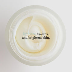 goop jar beside coin displaying 1.7 fl oz scale and convenient travel-friendly size