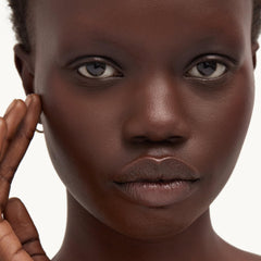 goop cream next to makeup and sunscreen showing layering and daytime routine benefit