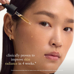goop serum drop on fingertip showing lightweight texture and hydration
