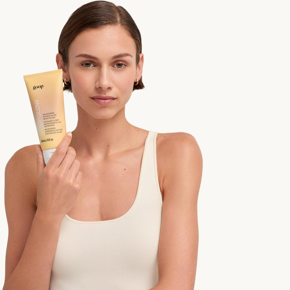 goop product next to ruler and hand for size and scale clarity