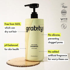 grab!ty bottle in hand showing 16.06 fl oz scale and portability