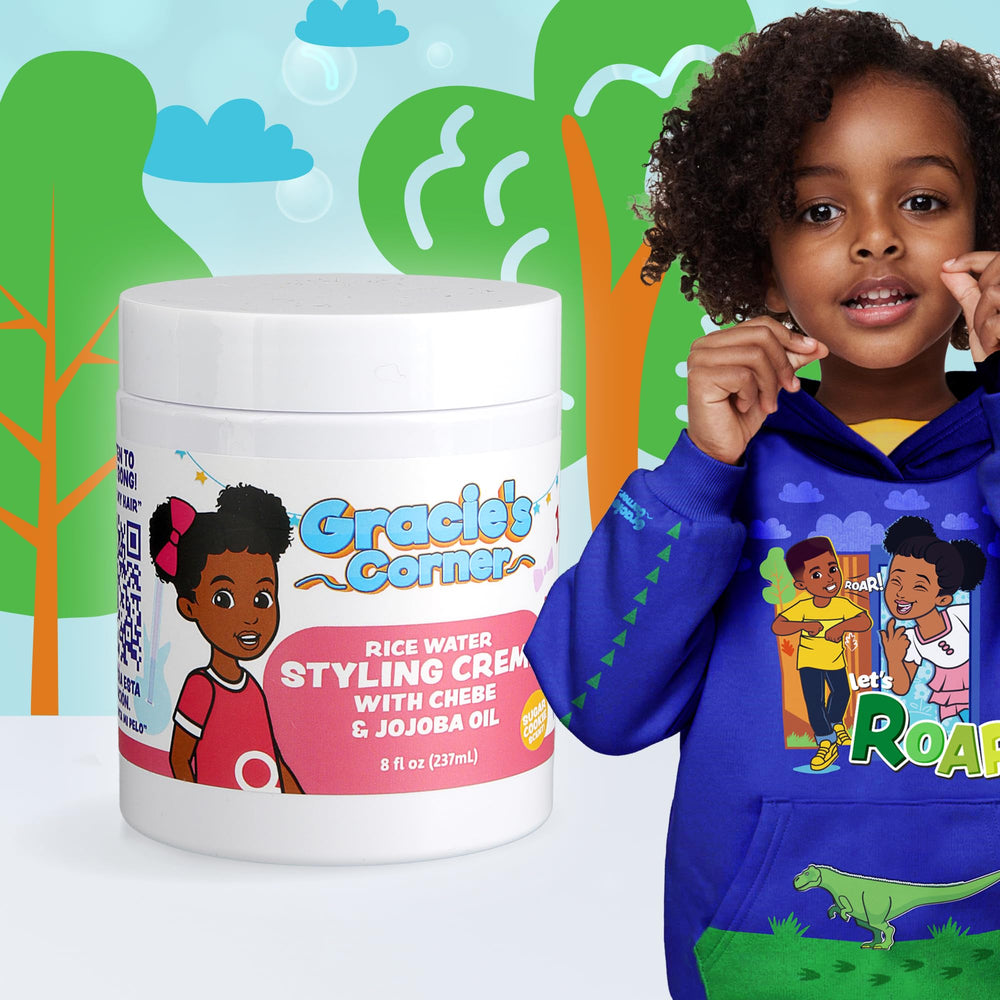 Gracie's Corner applying crème to child's curls for defined styling