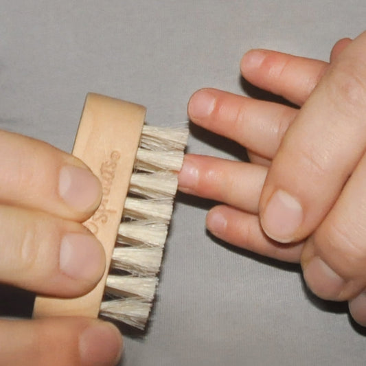 Green Sprouts wooden handle close-up showing warm grip and sustainable material benefit
