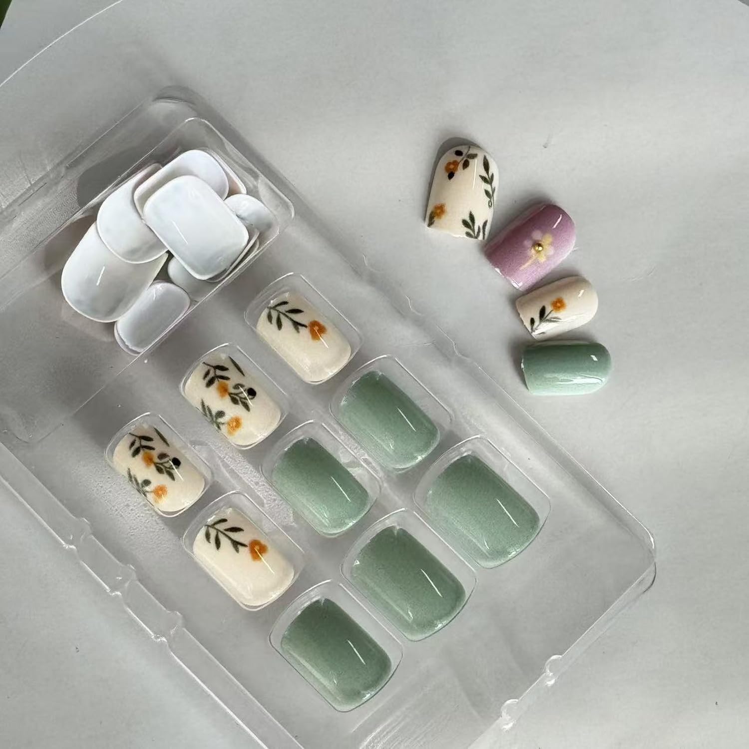 GRITOSE nails held in hand showing size comparison for easy fitting